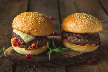 Big burger with cheese and cranberry sauce