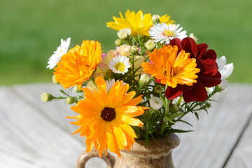 Fototapeta premium autumnal colorful bunch of flowers with asters, calendula and dahlias