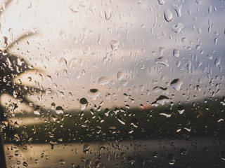 View of ATR 72-600 plane's propeller blades captured from passenger window. Selected focus 