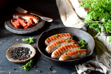 Homemade sausages from turkey (chicken) fried in a frying pan