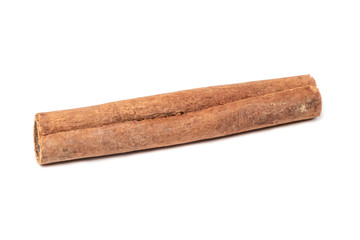 Closeup of cinnamon stick, isolated on white background. Shallow  DOF.