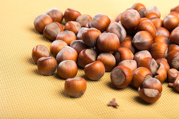 close up of hazelnuts on table .