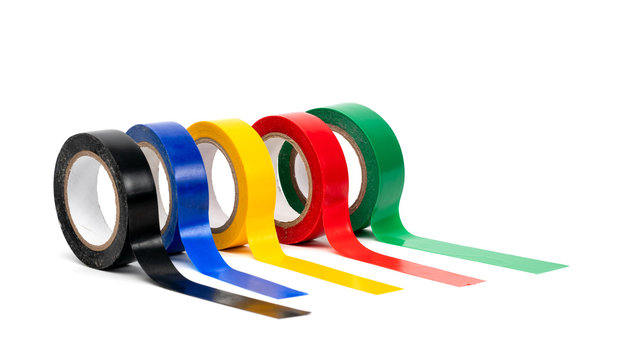 Rolls of insulation adhesive tape, multi colored ribbons on a white background. Bright and colorful insulation tape