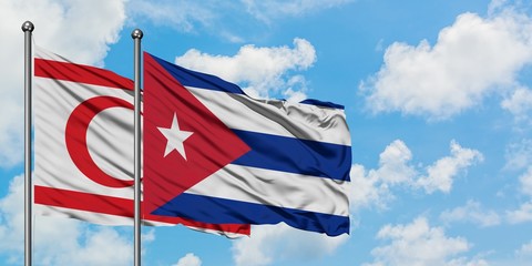 Northern Cyprus and Cuba flag waving in the wind against white cloudy blue sky together. Diplomacy concept, international relations.