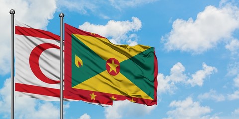 Northern Cyprus and Grenada flag waving in the wind against white cloudy blue sky together. Diplomacy concept, international relations.