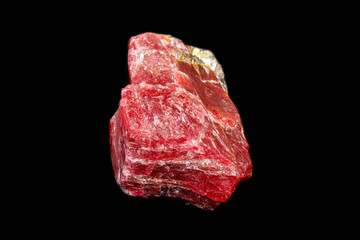 macro mineral Rhodonite stone on a black background