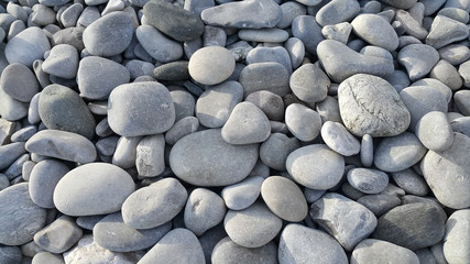 Nature background from gray sea pebbles