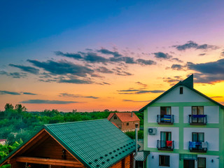 Beautiful Karpathian mountains and tender sunset sky over resort