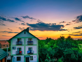 Beautiful Karpathian mountains and tender sunset sky over resort