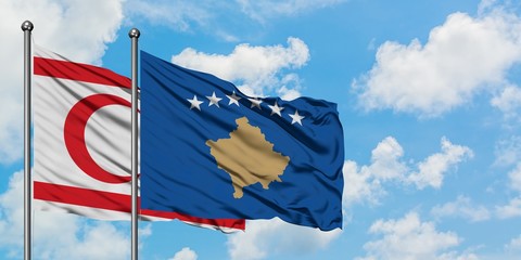 Northern Cyprus and Kosovo flag waving in the wind against white cloudy blue sky together. Diplomacy concept, international relations.