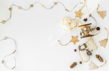 Rustic Handmade Christmas decorations from natural materials  and garland on a white background with copy space. The concept of the new year, christmas and winter holidays.Flat lay, top view.