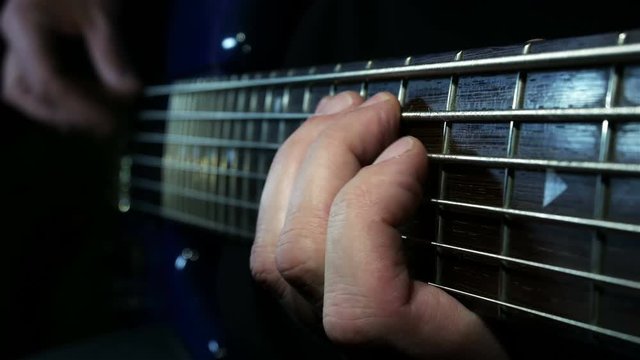 Left hend on bass guitar