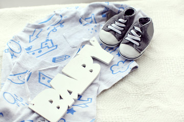 Fototapeta na wymiar little baby shoes on white background