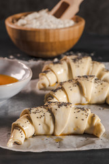 The dough for croissants. Preparation of croissants in the kitchen with ingredients.