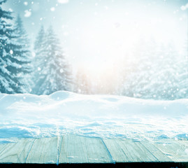 Merry Christmas and happy New Year greeting background with table .Winter landscape with fir tree