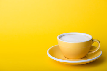 yellow cup on a yellow background