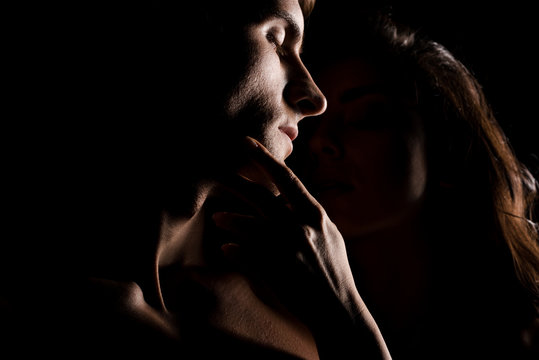 Beautiful Sexy Couple Hugging, Isolated On Black With Backlight