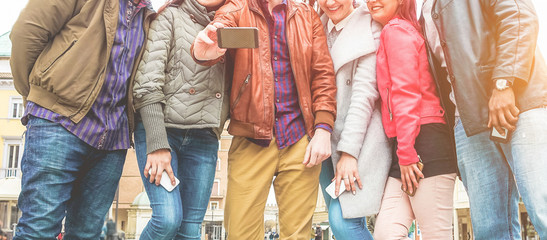 Happy millennials friends making video with smartphone - Young students people having fun with new...