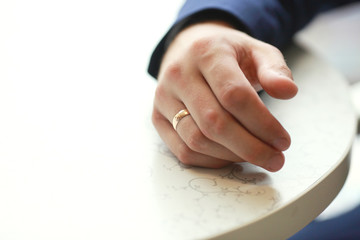 Preparing for wedding. Groom buttoning cufflinks on white shirt before wedding. Groom's clothes. Close up.