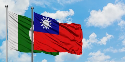 Pakistan and Taiwan flag waving in the wind against white cloudy blue sky together. Diplomacy concept, international relations.