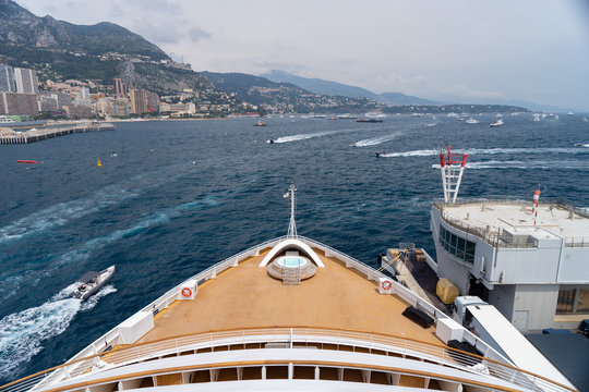 Photos from the bow of cruise ship surrounded by lots of boats docked in Monte Carlo, Monaco.