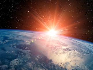 Sunrise on the planet earth. The elements of this image furnished by NASA.