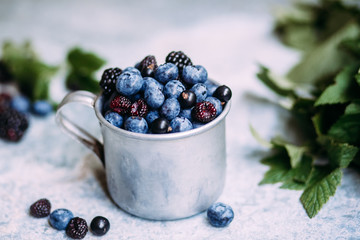 blueberries in a bowl on wooden table