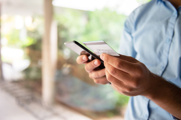 Male hand Paying online with credit card