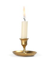Burning  candle in golden vintage candlestick isolated on white background...