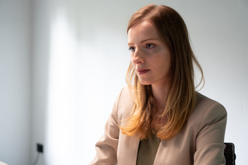 Young beautiful woman looking at computer	