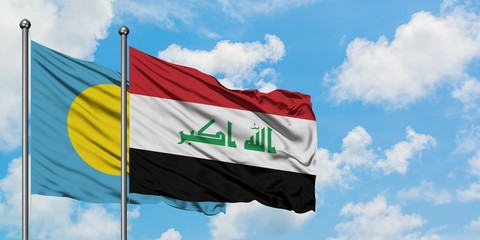 Palau and Iraq flag waving in the wind against white cloudy blue sky together. Diplomacy concept, international relations.