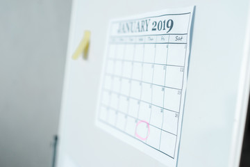 Naklejka na ściany i meble selective focus of calendar with january lettering on flipboard