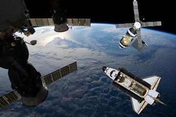 Fototapeta premium Space station. Different spaceships above the earth. The elements of this image furnished by NASA.
