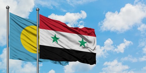 Palau and Syria flag waving in the wind against white cloudy blue sky together. Diplomacy concept,...
