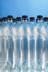 empty plastic bottles on blue background