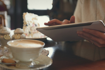 Woman using tablet in the cafe
