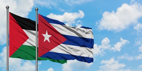 Palestine and Cuba flag waving in the wind against white cloudy blue sky together. Diplomacy concept, international relations.