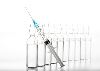 Glass medicine ampoules and Syringe on white background