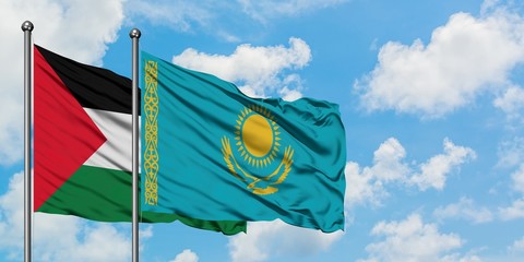 Palestine and Kazakhstan flag waving in the wind against white cloudy blue sky together. Diplomacy concept, international relations.