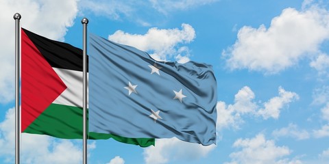 Palestine and Micronesia flag waving in the wind against white cloudy blue sky together. Diplomacy concept, international relations.
