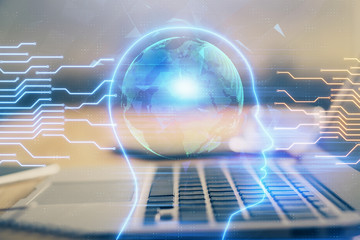 Double exposure of table with computer and brain hologram. Data innovation concept.