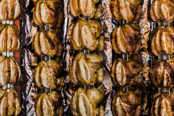 Roasted chicken hanging for sale in open market