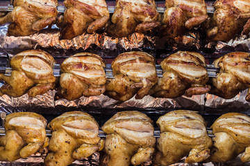 Roasted chicken hanging for sale in open market