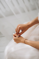  portrait of the hands of the bride, tender girl. selective focus, film and grain photo