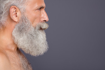 Close up profile photo of aged handsome man looking focused empty space after hair cutting...