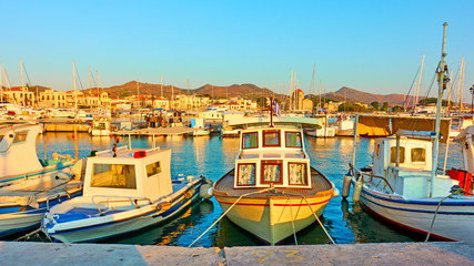 Fototapeta na wymiar Fshing boats in the port of Aegina town
