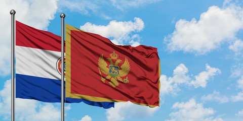 Paraguay and Montenegro flag waving in the wind against white cloudy blue sky together. Diplomacy concept, international relations.