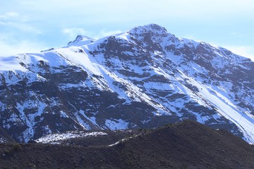 snowy mountain and valley in Andes of Chile