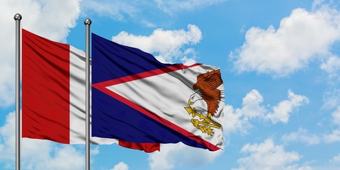 Peru and American Samoa flag waving in the wind against white cloudy blue sky together. Diplomacy...