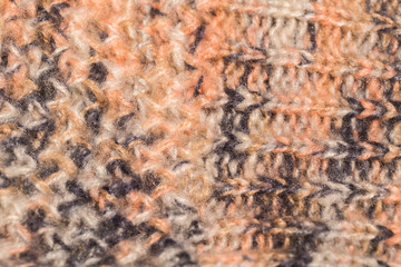 Closeup view of beautiful flyffy colorful knitted texture of warm winter clothes. Horizontal color photography.
